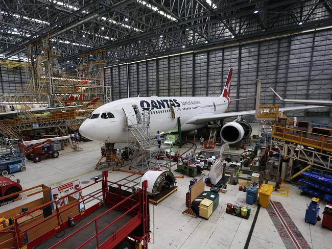 CMNEWS_Qantas CEO Alan Joyce photographed here given Queensland Premier Campbell Newman and Tourism Minister Jann Stucky inside the maintenance hangar in Brisbane this morning Tuesday Dec.09th, 2014. Pictures: Jack Tran / The Courier Mail