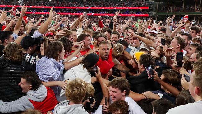 Will Hayward, pictured to the left of Lance Franklin after he kicked his 1000th goal, cherished being part of the historic moment. Picture: Getty Images