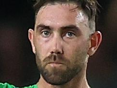 MELBOURNE, AUSTRALIA - JANUARY 13: Glenn Maxwell of the Stars raises his bat after scoring a half century during the Men's Big Bash League match between the Melbourne Renegades and the Melbourne Stars at Marvel Stadium, on January 13, 2022, in Melbourne, Australia. (Photo by Mike Owen/Getty Images)