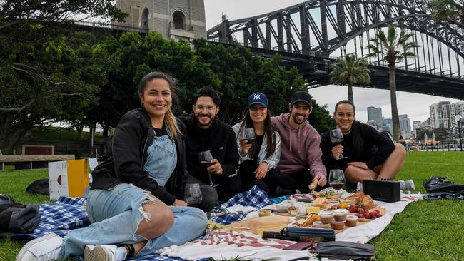 Coco Guerrero, Felipe Torres, Carla Felizzola, Nicholas Felizzola and Jolie Mg enjoy a picnic, with beer and bubbles, on Saturday in Sydney. Picture: NCA NewsWire/Bianca De Marchi