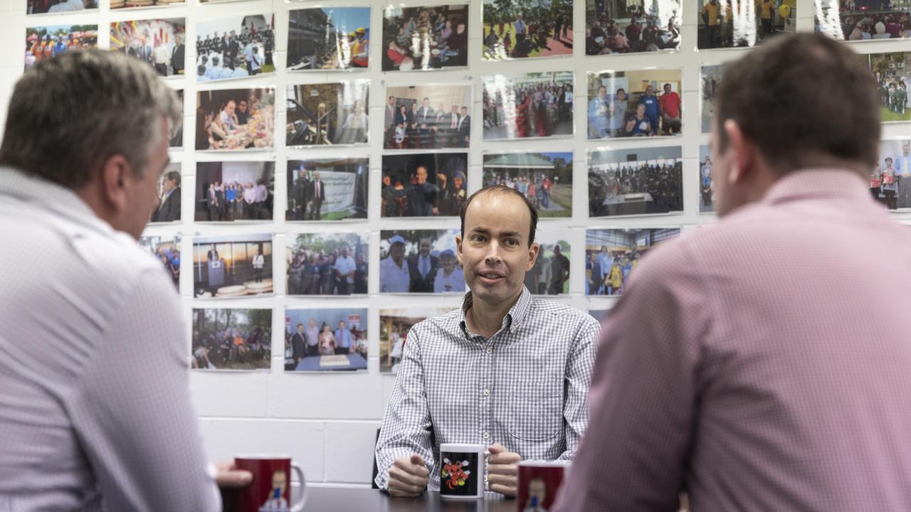 Duncan Pegg with work colleagues at his Sunnybank Hills office. Picture: Mark Cranitch