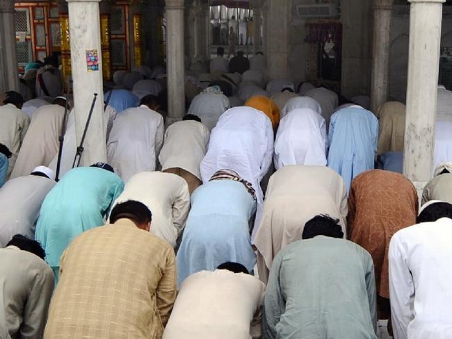 02/07/2010 WIRE: Pakistani Muslims offer Friday prayers at the shrine of Muslim Sufi saint Hazrat Syed Ali bin Usman Hajweri, popularly known as Data Ganj Bakhsh, in Lahore on July 2, 2010. The Pakistani Taliban denied any involvement in a twin suicide bombing on an Islamic shrine in the eastern city of Lahore which killed 42 people and wounded 175 others. AFP PHOTO/ARIF ALI