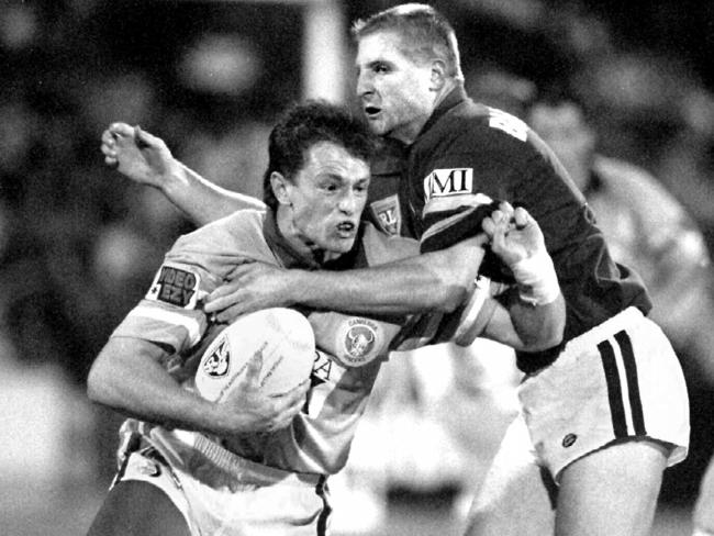 Michael Maguire (L) tackled by Illawarra’s Dean Callaway while playing for Canberra in the 1995 Winfield Cup. Picture: Angelo Soulas