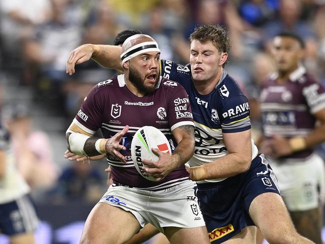 Jazz Tevaga of the Sea Eagles is tackled by Harry Edwards of the Cowboys during the round eleven NRL match between Cowboys and Sea Eagles at Queensland Country Bank Stadium, on May 17, 2025, in Townsville, Australia. (Photo by Ian Hitchcock/Getty Images)