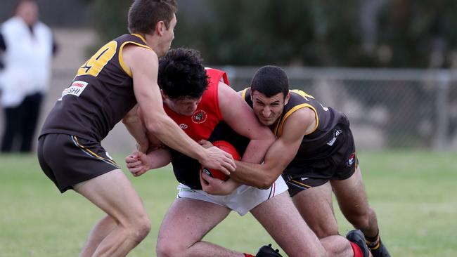 Daniel Caruso tackles Joel Randell.