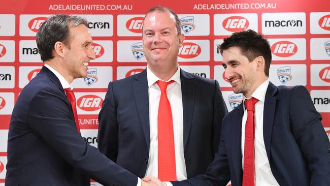 Adelaide United chairman Piet van der Pol, Aurelio Vidmar (left) and Nathan Kosmina (right) when the former skipper and coach was announced as the club’s new football director in September 2018. (AAP Image/David Mariuz)