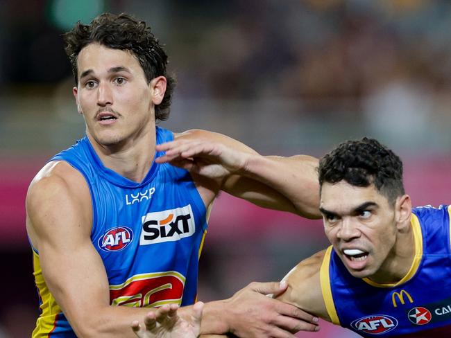 BRISBANE, AUSTRALIA - MAY 05: Wil Powell of the Suns and Charlie Cameron of the Lions in action during the 2024 AFL Round 08 match between the Brisbane Lions and the Gold Coast SUNS at The Gabba on May 05, 2024 in Brisbane, Australia. (Photo by Russell Freeman/AFL Photos via Getty Images)