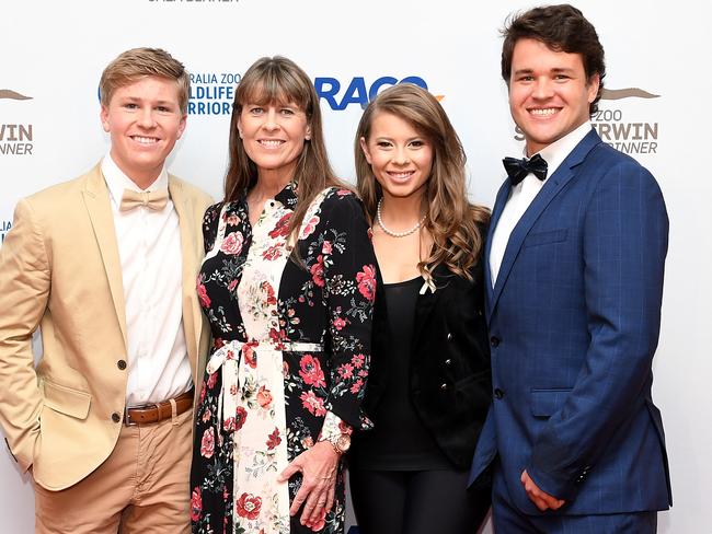 (L-R) Robert, Terri and Bindi Irwin with Chandler Powell at the annual Steve Irwin Gala Dinner at the Brisbane Convention &amp; Exhibition Centre on Saturday. Picture: Bradley Kanaris/Getty Images