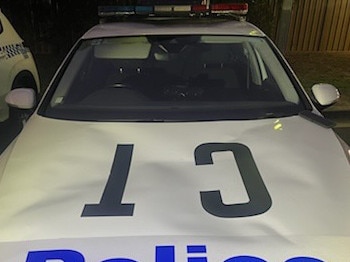 A police car was damaged after 10 “aggressive males” allegedly surrounded officers and made threats, with one jumping on the cop car. Picture: Campbelltown City Police Area Command