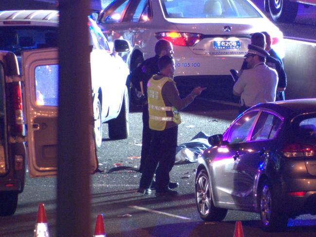 A taxi also became involved in the crash, police said. The man and woman, who had been standing on the roadside, died at the scene. Picture: OnScene Bondi