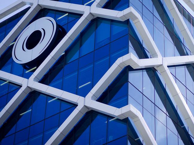 The Macquarie Group Ltd. logo is displayed on the facade of the Macquarie Group Building in Sydney, Australia, on Friday, April 27, 2012. Macquarie Group Ltd., Australia's largest investment bank, said it's relying on cost cuts to revive earnings after a slump in trading income and dealmaking dragged full-year net income to an eight-year low. Photographer: Ian Waldie/Bloomberg