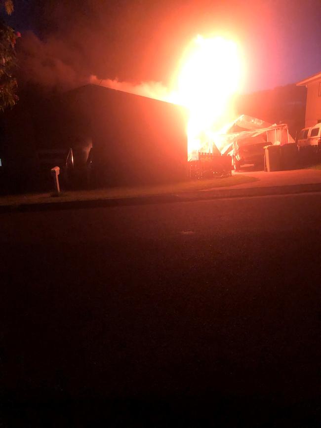 The raging fire on Stewart Terrace, where a sleeping girl was rescued metres form the flames. Photo: Emma Avery