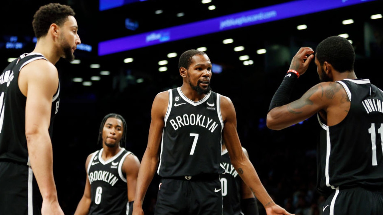 NEW YORK, NEW YORK - OCTOBER 27: Kevin Durant #7 talks with Ben Simmons #10 and Kyrie Irving #11 of the Brooklyn Nets during the second half against the Dallas Mavericks at Barclays Center on October 27, 2022 in the Brooklyn borough of New York City. The Mavericks won 129-125. NOTE TO USER: User expressly acknowledges and agrees that, by downloading and or using this photograph, User is consenting to the terms and conditions of the Getty Images License Agreement. (Photo by Sarah Stier/Getty Images)