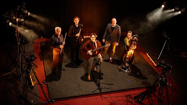 Indigenous singer-songwriter Nancy Bates, centre, with Adelaide Symphony Orchestra flautist Geoffrey Collins, clarinetist Dean Newcomb, composer Julian Ferraretto and contra bassoonist Jackie Newcomb in the Grainger Studio. Picture: MATT TURNER