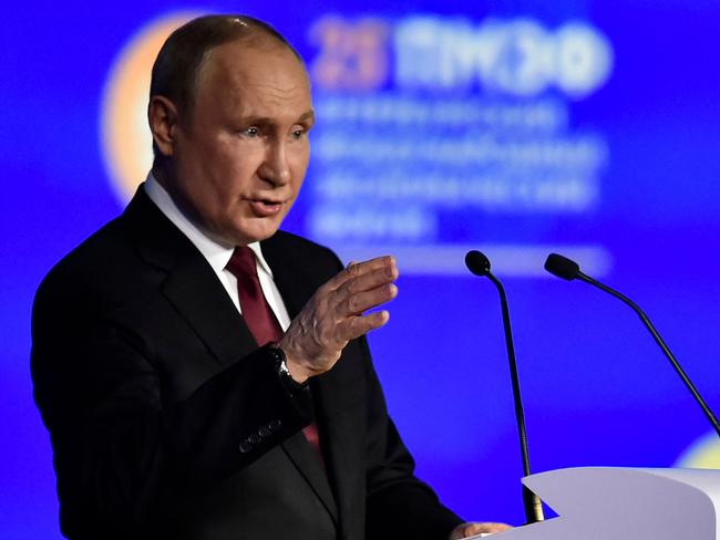 Russian President Vladimir Putin gives a speech at the Saint Petersburg International Economic Forum. (Photo by Olga MALTSEVA / AFP)