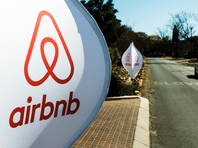 The logos of Airbnb Inc. sit on banners displayed outside a media event in Johannesburg, South Africa, on Monday, July 27, 2015. Airbnb is hoping to spread its unique brand of hospitality throughout Africa. Photographer: Waldo Swiegers/Bloomberg