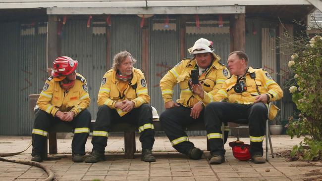 RFS fireys take a well earning break at the Sunnataram Buddhist retreat in Penrose. Picture: Richard Dobson