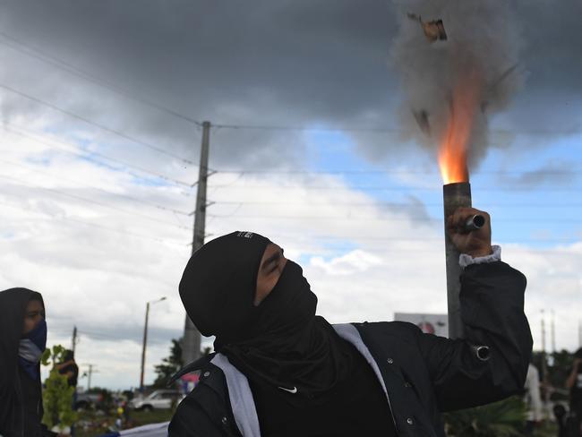 A man fires a homemade mortar in Managua during a protest against President Daniel Ortega’s government. Picture: Marvin Recinos