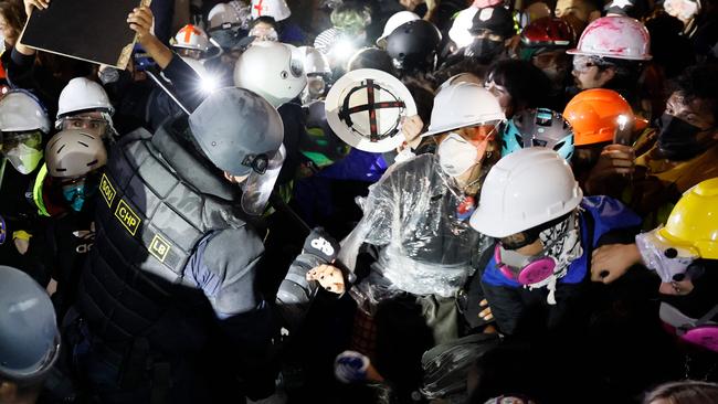 Police clash with pro-Palestinian students after destroying part of the encampment barricade on the campus of the University of California, Los Angeles in May. Picture: Etienne Laurent/AFP