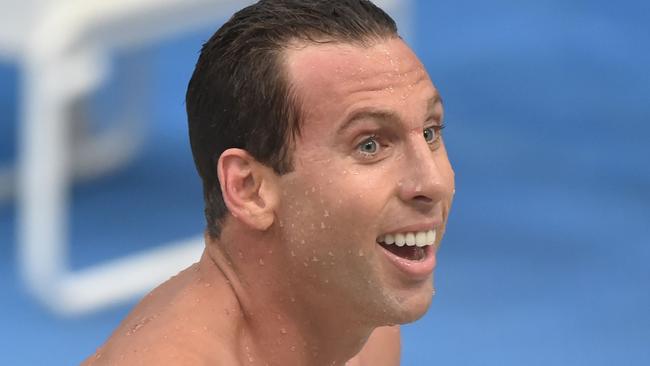 (FILES) This file photo taken on April 3, 2015 shows dual Olympic champion Grant Hackett smiling after finishing third in the 400-metres freestyle final in his comeback swim after seven years out of the pool at Australia's world championship trials in Sydney. Hackett may have been drinking prior to an alleged mid-air "nipple" squeeze on a fellow passenger, a witness said on April 18, 2016. The 35-year-old dual Olympic champion, who recently failed in his bid to make the Australian team for Rio, was reportedly questioned by police after the flight landed in Melbourne. / AFP PHOTO / PETER PARKS / IMAGE STRICTLY FOR EDITORIAL USE - STRICTLY NO COMMERCIAL USE