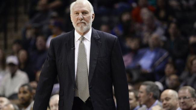 San Antonio Spurs head coach Gregg Popovich watching play during the first half of an NBA basketball game against the Chicago Bulls.