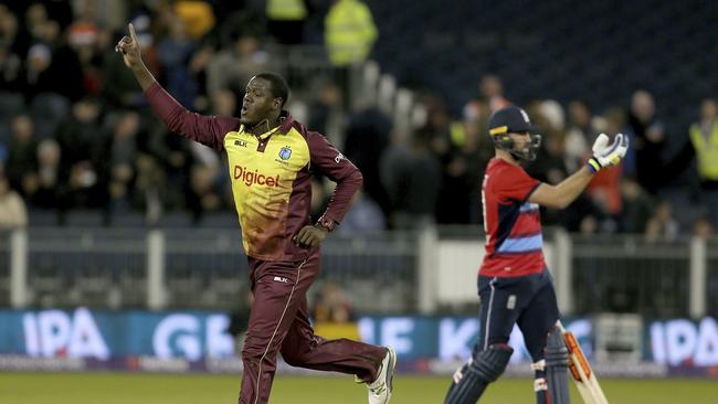 West Indies captain Carlos Brathwaite celebrates his side’s win over England.