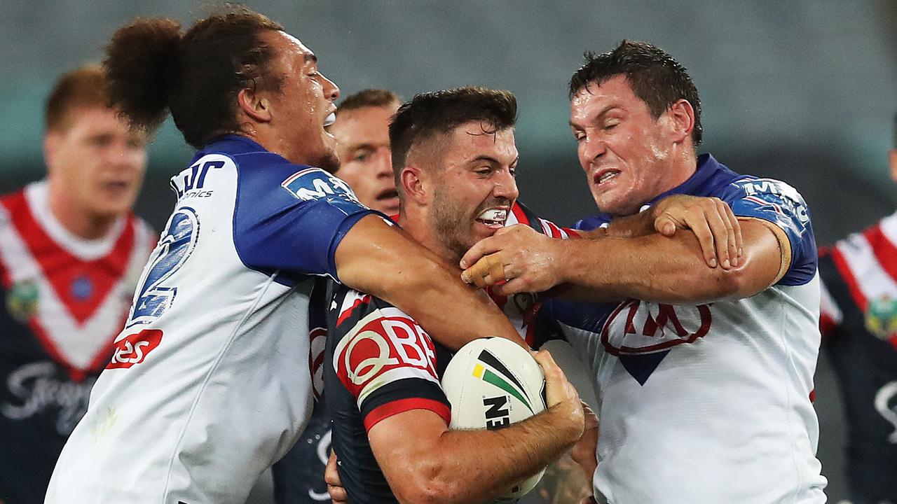 Roosters' James Tedesco gets tackled.