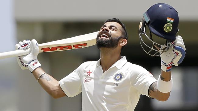 India's captain Virat Kohli celebrates after scoring a double-century.