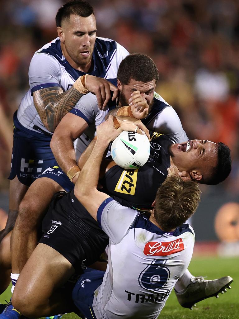 Spencer Leniu of the Panthers yells in pain as Cameron Munster (6) rolls on to his leg in a tackle. Picture: Cameron Spencer/Getty Images)