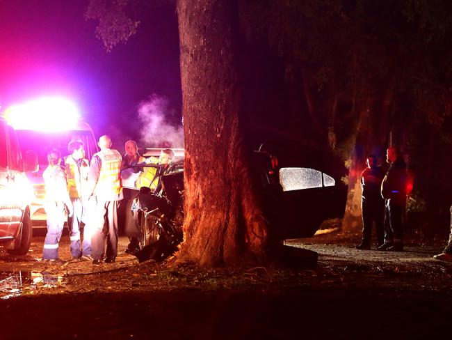 A male in his 20's is deceased after his car collided with a tree at high speed. A witness said the car was traveling along Henry Lawson Drive at Georges Hall in excess of 80 kph when it drove straight off the road and collided with a tree. The witness said it looked like the driver may have fallen asleep on the dark stretch of road. Police established a crime scene and blocked the road whilst investigations were underway. Pics Bill Hearne