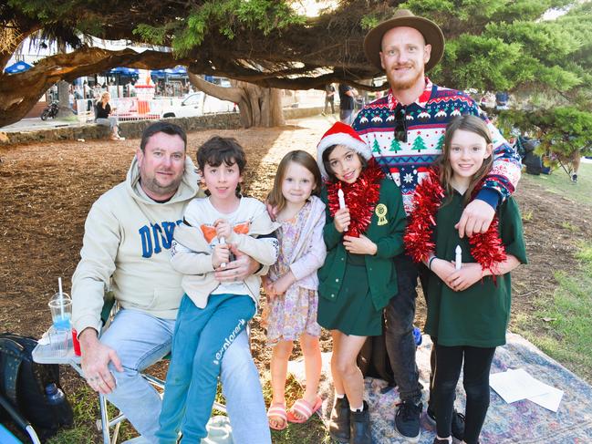 Darren Tyrrell, Toby, Freya, Ivy, Bryce Mold and Lydia getting festive at the Phillip Island Christmas Carols by the Bay at the Cowes Foreshore on Tuesday, December 10, 2024. Picture: Jack Colantuono