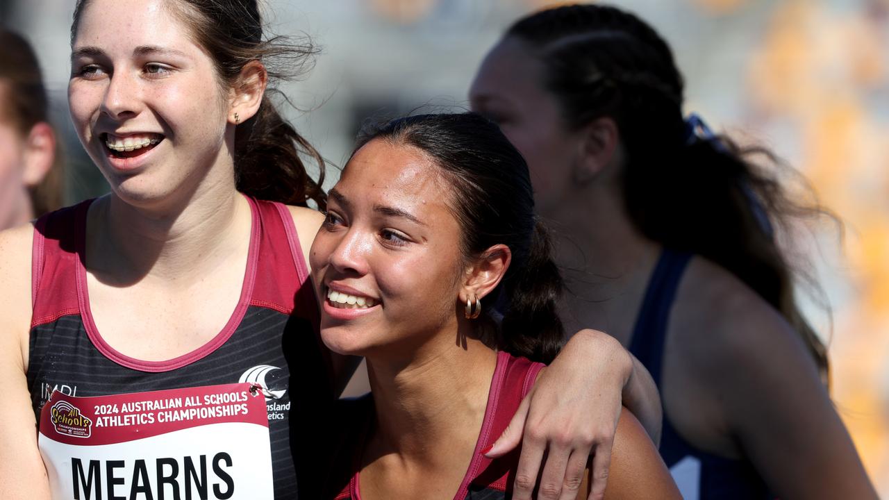 Thewbelle Philp celebrates her Day 1 100m dash with Amaya Mearns whose blistering 200m was a competition record. Picture David Clark