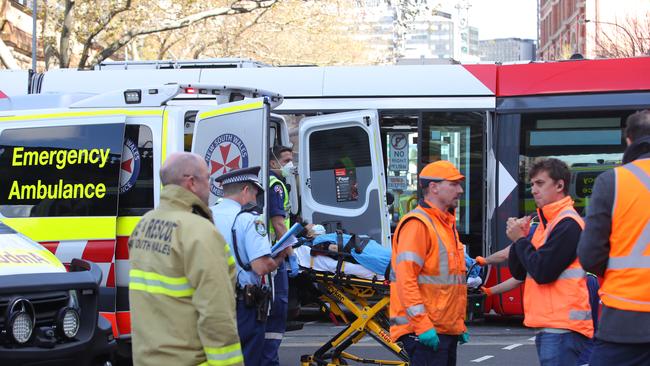 Two people were hospitalised after a tram and fire truck collided on Monday. Picture: Richard Dobson