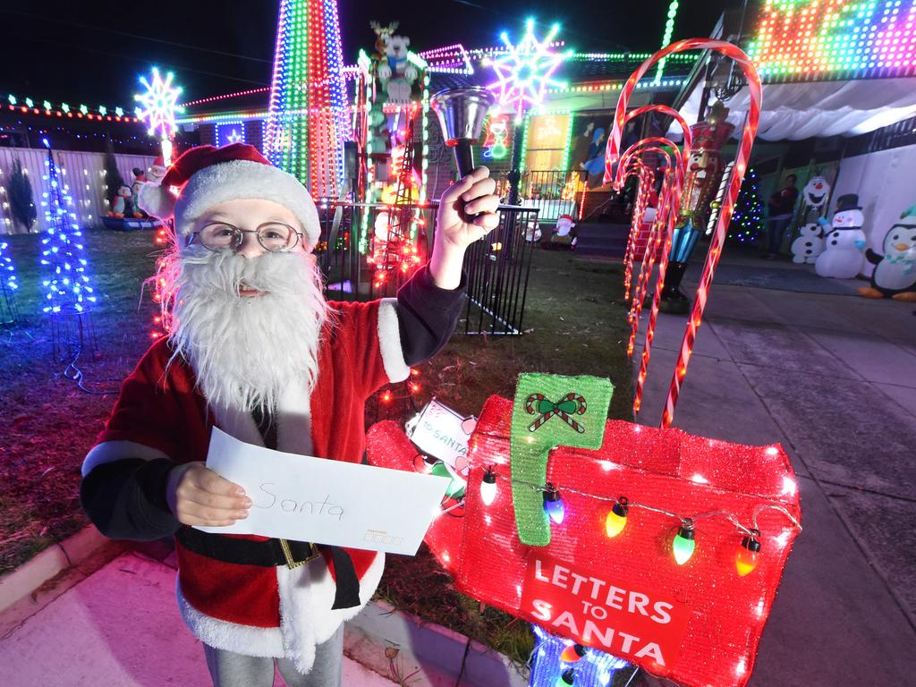 Aron Symonds, dressed as Santa, posts a letter to the jolly man. Picture: Tony Gough