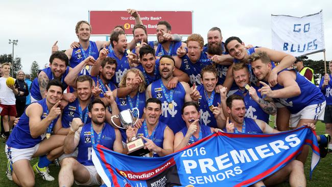 Hastings players celebrate with the premiership cup and pennant. Picture: Mark Dadswell