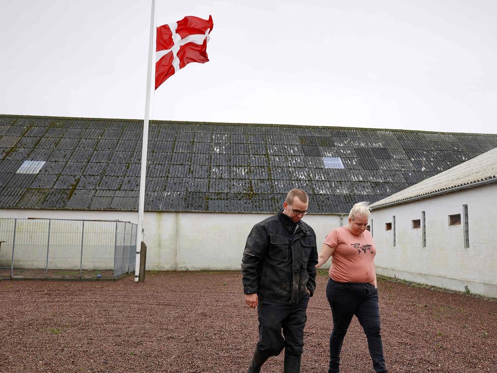 Mink farmers Peter and Trine Brinkmann Nielsen lowered their flag to half mast after hearing they will have to cull their 250,000 mink. Picture: Claus Bjoern Larsen / Ritzau Scanpix / AFP