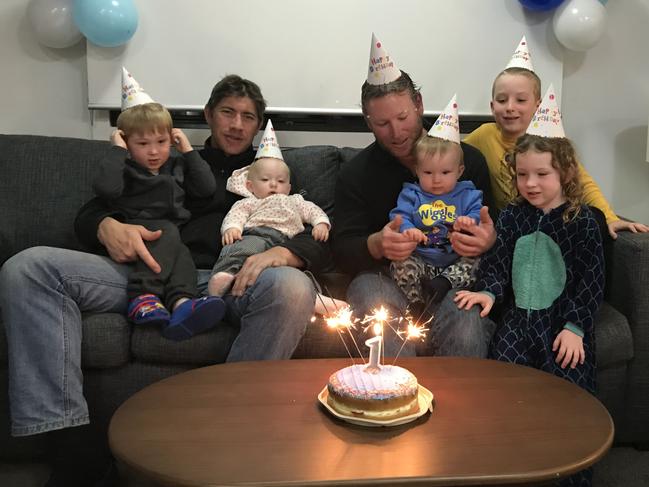 Paul Thomas with his children James and Hannah and David Argall with William, Alaska, and Brett on William's first birthday. Picture: Supplied