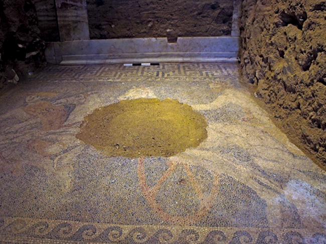 Grave find ... Archaeologists digging through an ancient grave at Amphipolis, northern Greece, uncovered the 3-metre by-4.5 metre mosaic in what is likely the antechamber to the main burial room. Pic: AP Photo/Greek Culture Ministry