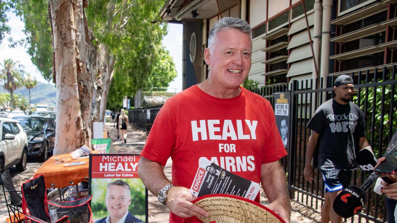 Labor Member for Cairns Michael Healy hands out how-to-vote cards at the Cairns State High School booth. Picture: Brian Cassey