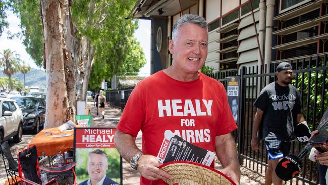 Labor Member for Cairns Michael Healy hands out how-to-vote cards at the Cairns State High School booth. Picture: Brian Cassey