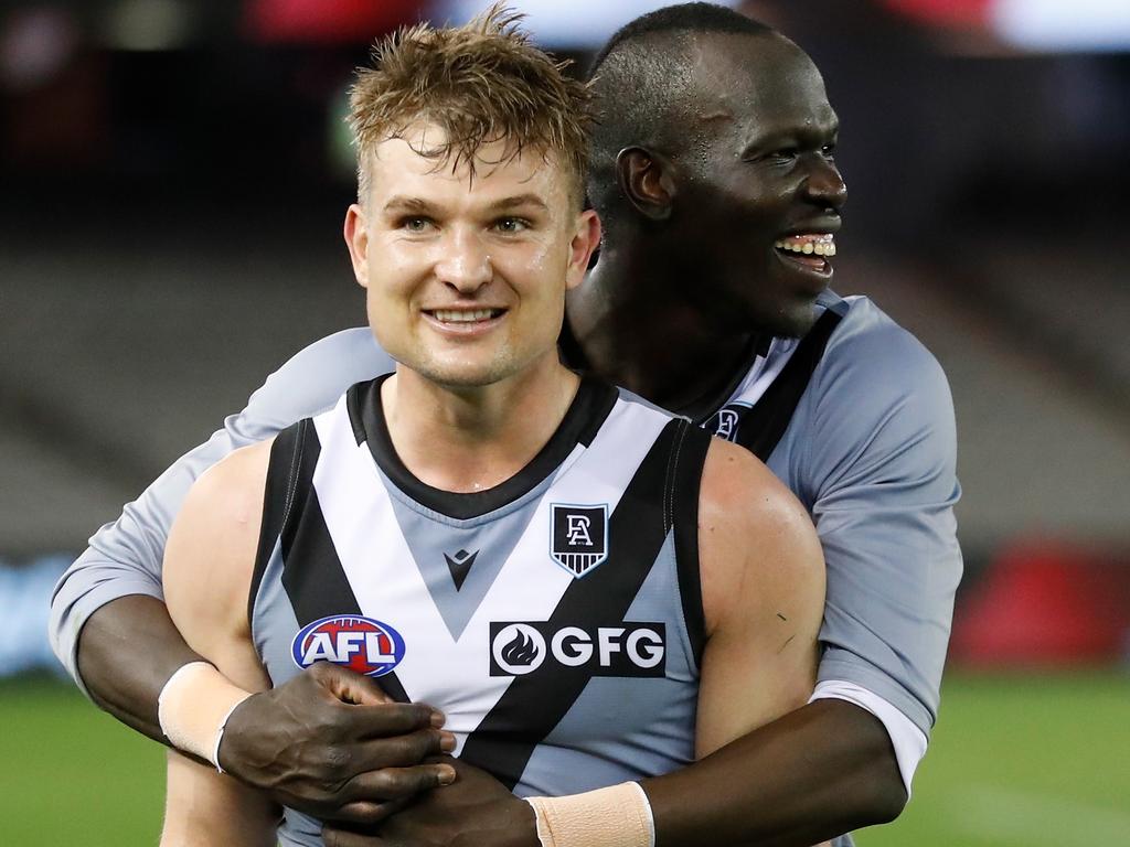 Ollie Wines and Aliir Aliir celebrate the win over the Saints. Picture: AFL Photos/Getty Images