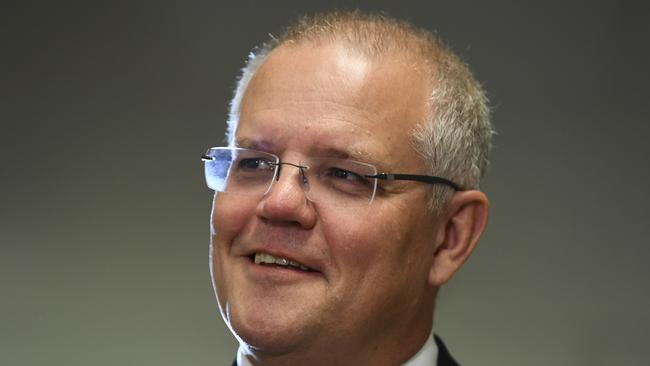 Australian Prime Minister Scott Morrison speaks to the media during a visit to Icon Cancer Centre in Canberra, Monday, April 1, 2019. Scott Morrison announced new Cancer treatment medication to be added to the Pharmaceutical Benefits Scheme (PBS) (AAP Image/Lukas Coch) NO ARCHIVING