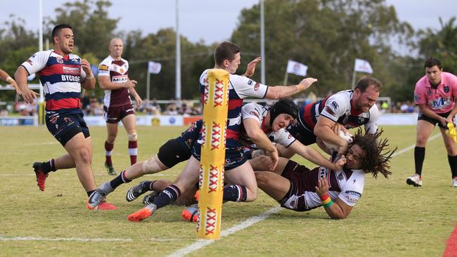 The Burleigh Bears Waka Wanahi is crash tackled over the sideline during the Gold Coast Rugby League Grand Final against the Runaway Bay Seagulls today at Pizzy Park. Photo Scott Powick Daily News