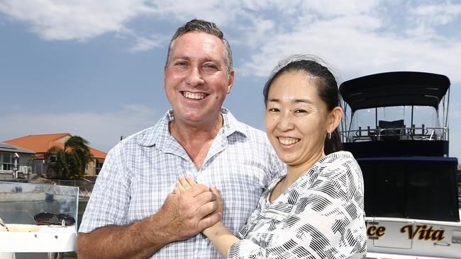 Gold Coast fishing stalwart Doug Burt has been struck down with an aggressive form of prostate cancer. Doug with his wife Misako Burt relax at their Runaway Bay home after Doug’s operation. Picture Glenn Hampson.