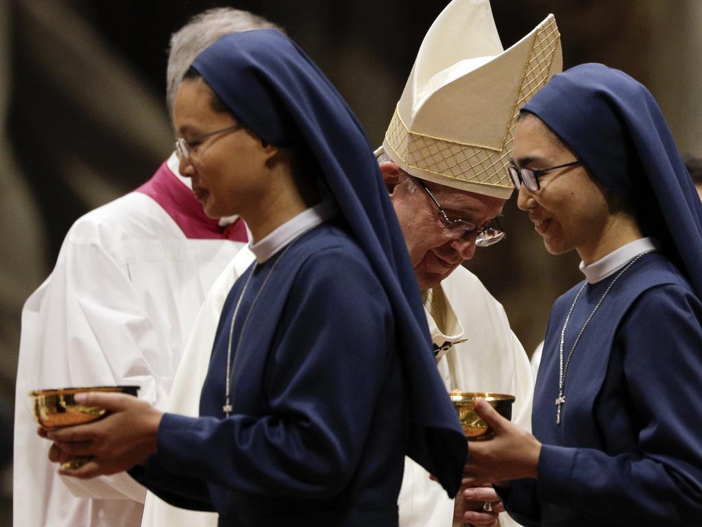 Nuns walk past Pope Francis during a Mass in St Peter's Basilica at the Vatican. The Pope admitted that nuns have been sexually abused by clerics. Picture: AP Photo/Gregorio Borgia