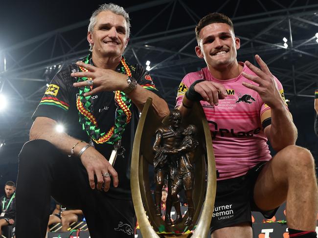 SYDNEY, AUSTRALIA - OCTOBER 06:  Nathan Cleary (R) of the Panthers poses with the Provan-Summons Trophy alongside his father and coach Ivan Cleary after winning the 2024 NRL Grand Final match between the Melbourne Storm and the Penrith Panthers at Accor Stadium on October 06, 2024, in Sydney, Australia. (Photo by Cameron Spencer/Getty Images)