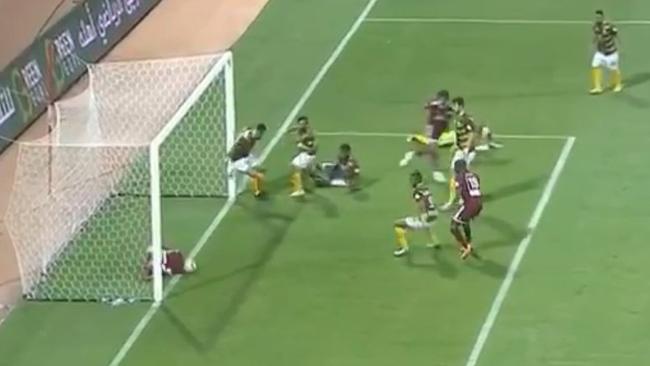 Al-Faisaly are stopped from scoring by their own player against Ohod