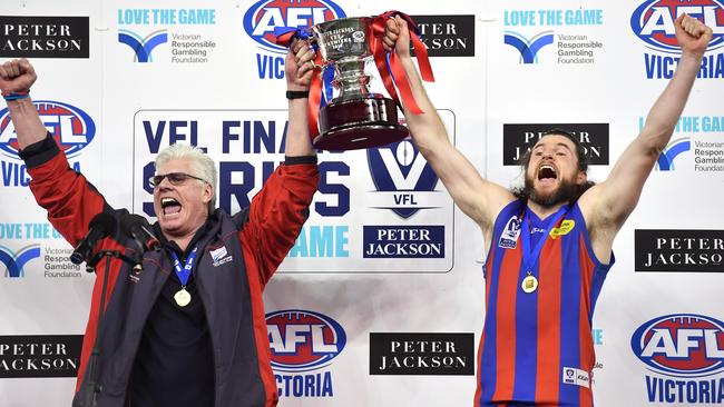 Port Melbourne coach Gary Ayres and captain Toby Pinwill celebrate the 2017 VFL flag.