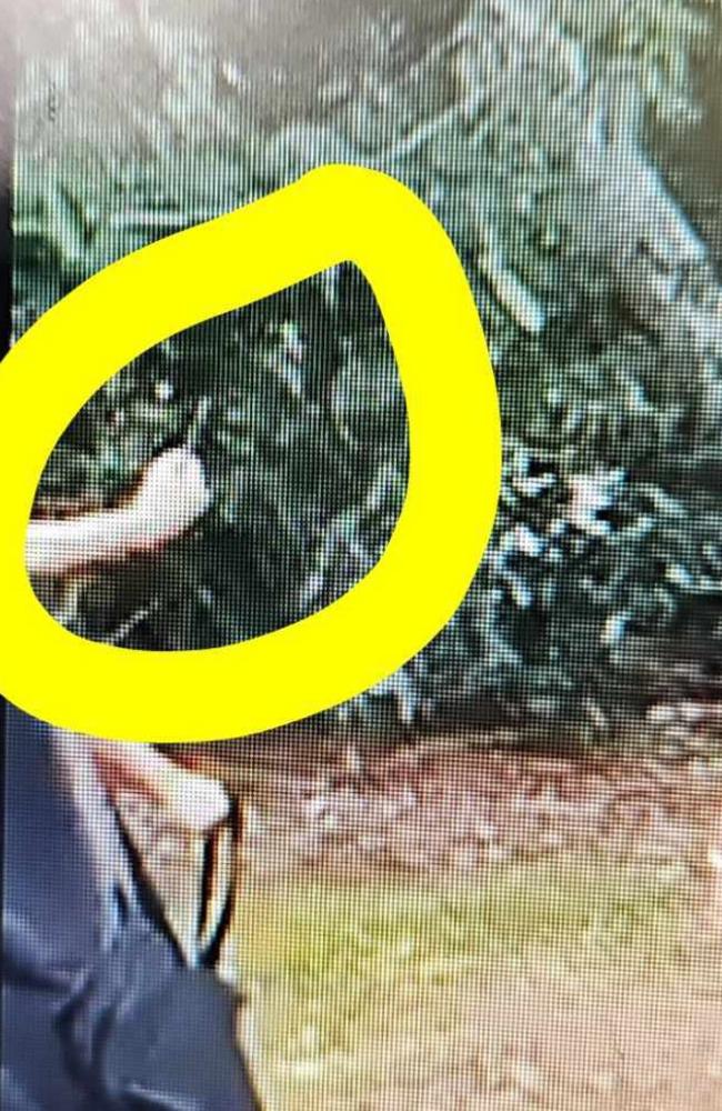 A screenshot capturing what the parents of a 14-year-old Palmerston College student say is a knife being wielded by students chasing their son near Palmerston Bus Terminal. Picture: Supplied