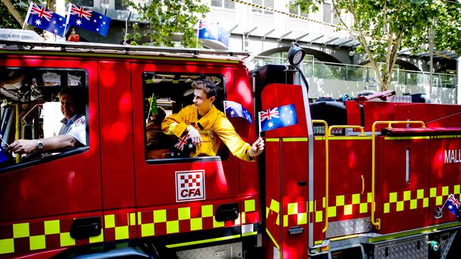 CFA fireys waved flags from their trucks. Picture: Nicole Cleary